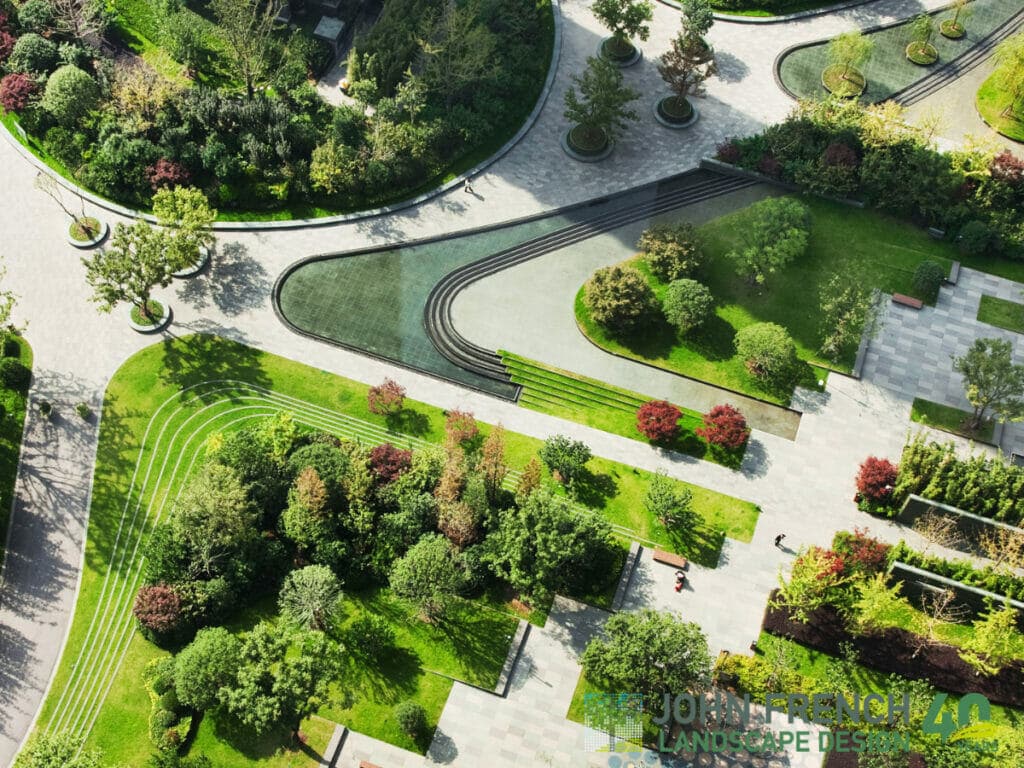 An intricately designed garden with flowers, trees, and paths.