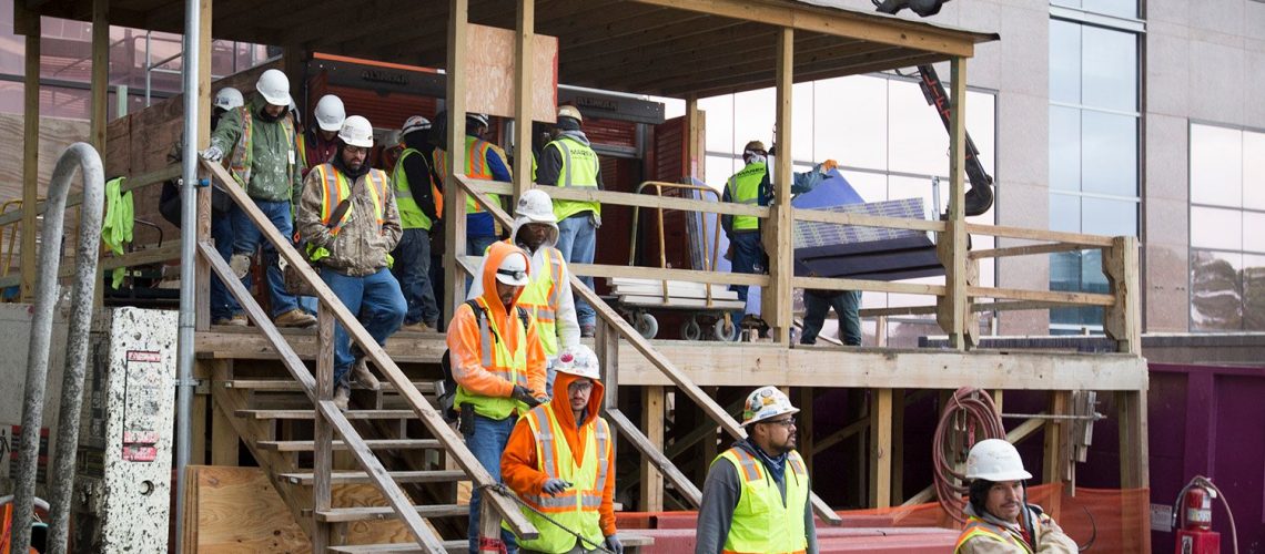 Construction workers take a break for lunch at a construction site for Texas Children's Hospital in Houston
