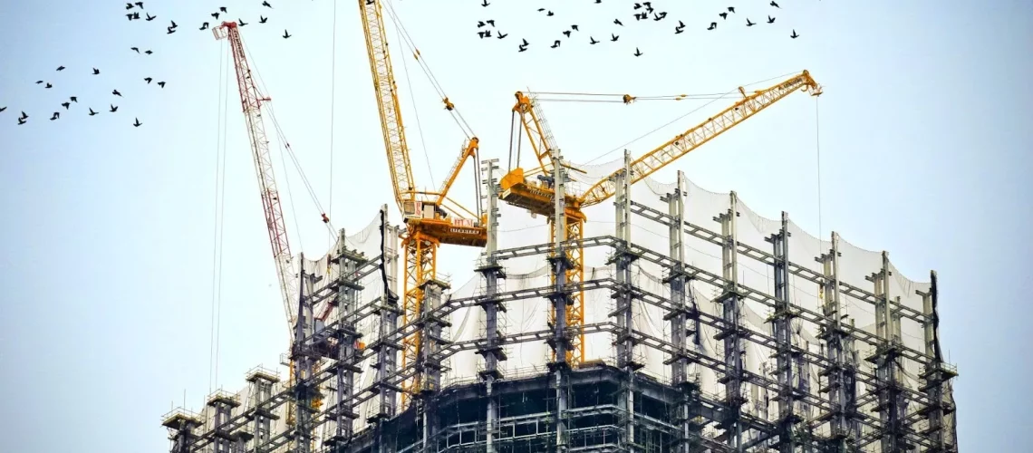 Construction site scaffolding and cranes