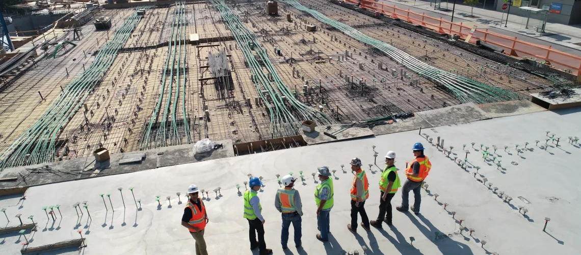 A few workers chatting on a construction site