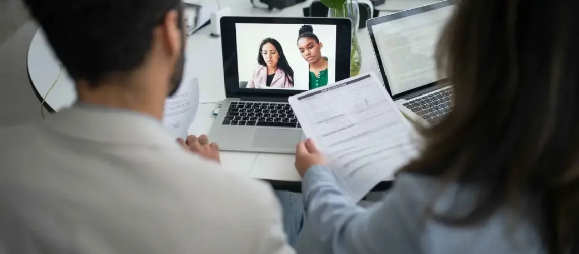 professionals conducting online job interviews